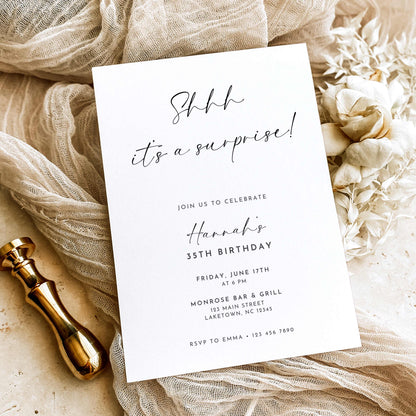 Minimalist surprise 35th birthday invitation featuring black handwritten Shhh It's a Surprise lettering, elegant typography, and party details on a white background.