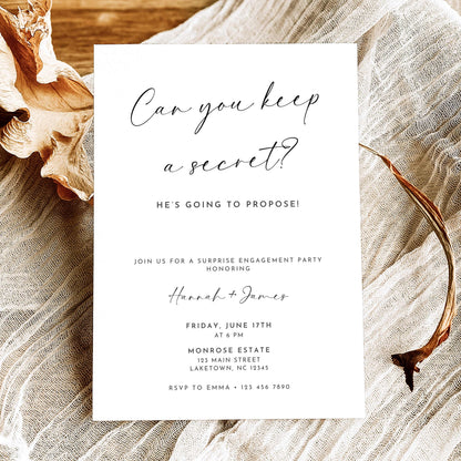Minimalist surprise engagement party invitation featuring Can You Keep a Secret handwritten calligraphy, He's Going to Propose wording, and elegant black typography on white.
