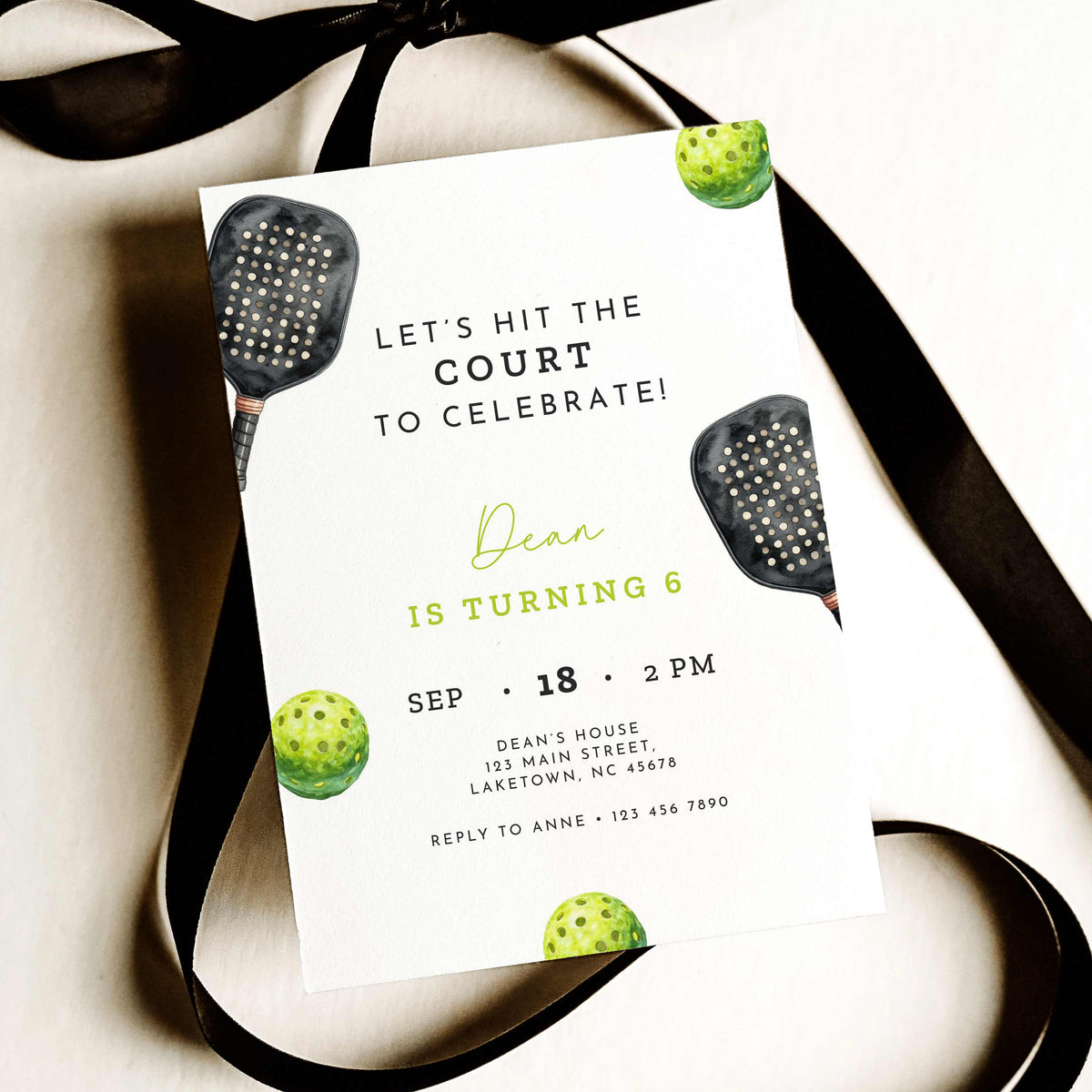 Black and neon green pickleball birthday invitation featuring a watercolor pickleball paddle and ball, modern sports typography, and a sixth birthday party theme.