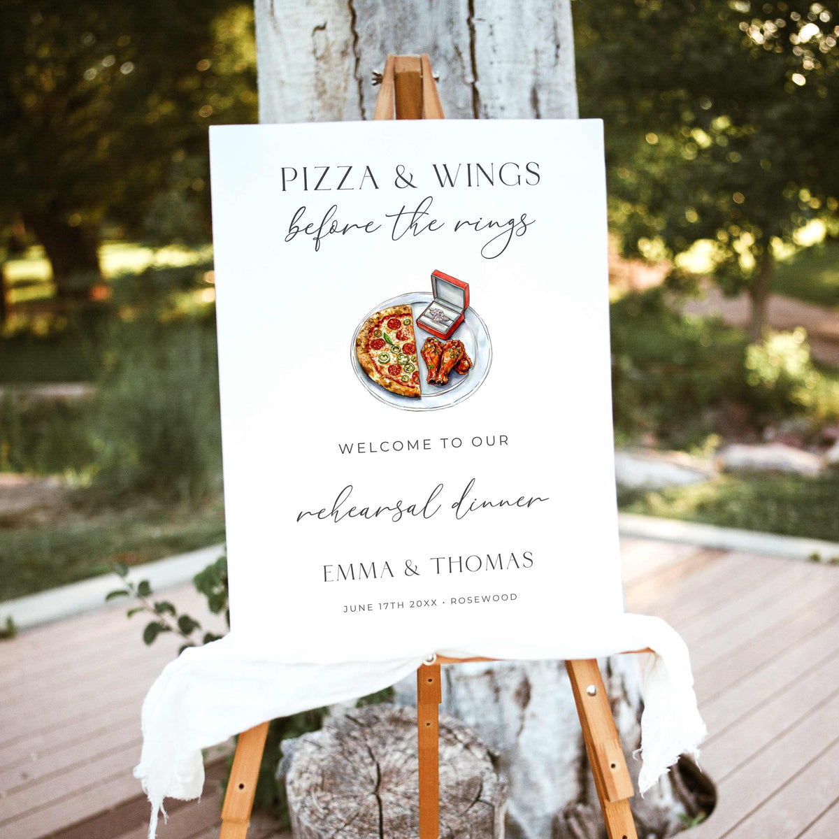 Pizza and Wings Before the Rings rehearsal dinner welcome sign featuring watercolor pizza, chicken wings, and an engagement ring box with elegant black typography on white.