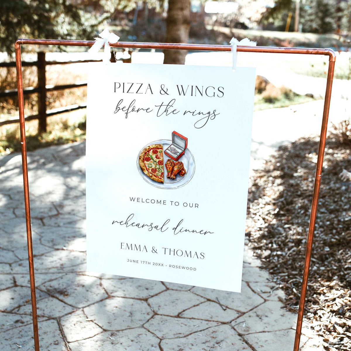 Pizza and Wings Before the Rings rehearsal dinner welcome sign featuring watercolor pizza, chicken wings, and an engagement ring box with elegant black typography on white.