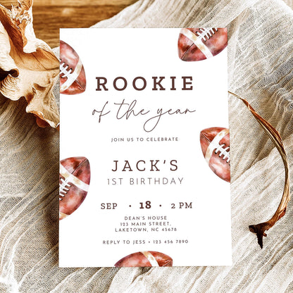 Rookie of the Year football first birthday invitation featuring vintage watercolor brown footballs, elegant script typography, and personalized birthday party details on a white background.