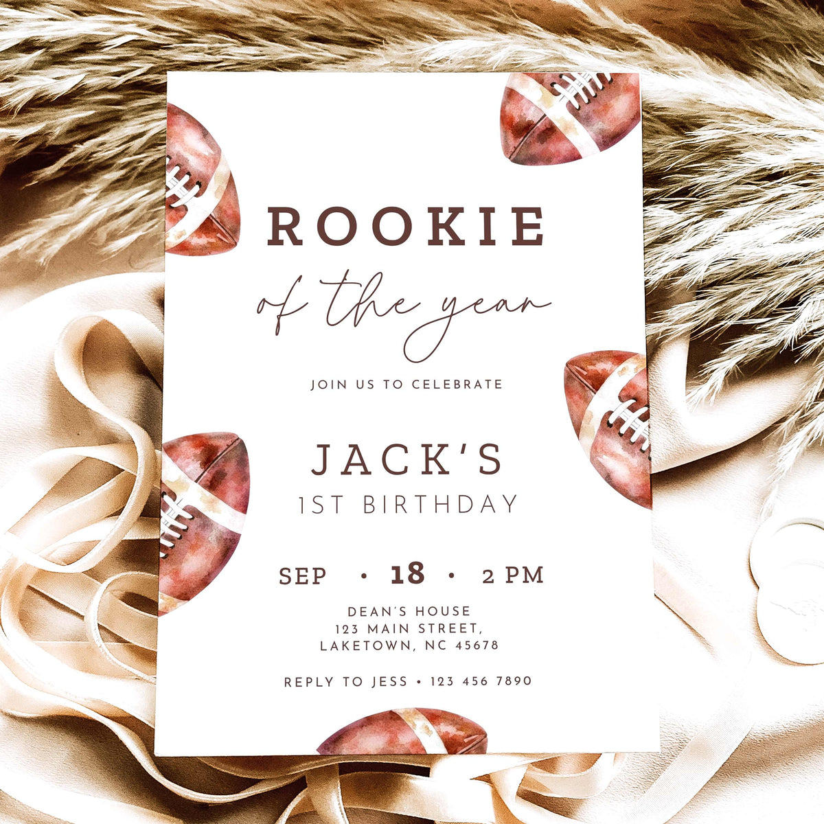 Rookie of the Year football first birthday invitation featuring vintage watercolor brown footballs, elegant script typography, and personalized birthday party details on a white background.