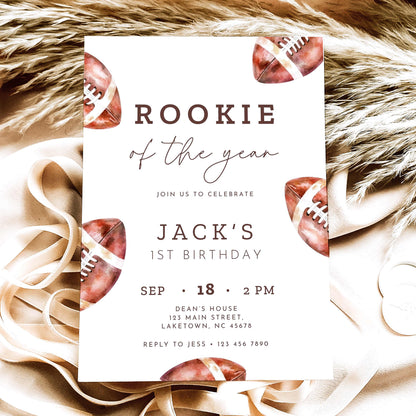 Rookie of the Year football first birthday invitation featuring vintage watercolor brown footballs, elegant script typography, and personalized birthday party details on a white background.