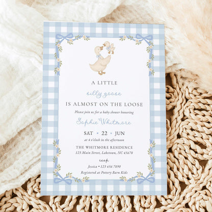 Blue gingham silly goose baby shower invitation with watercolor mother goose and gosling, pastel blue bows, white daisies, floral ribbon frame, and vintage lettering.