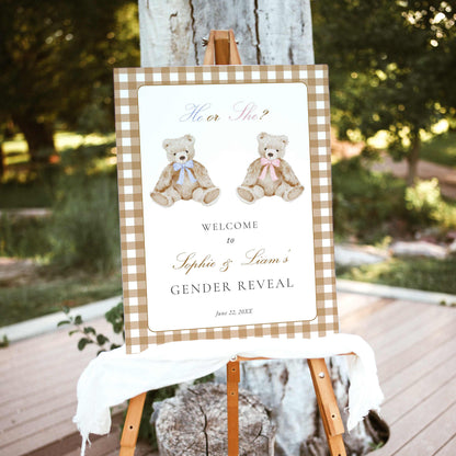 Vintage teddy bear gender reveal welcome sign with blue and pink bows and beige gingham